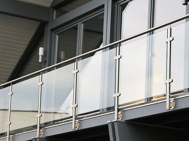 Clamped glass railing